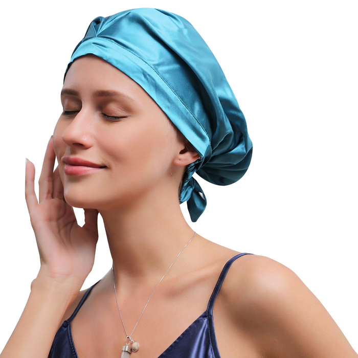 Person wearing a Peacock Green gathered sleep bonnet with a wide front band