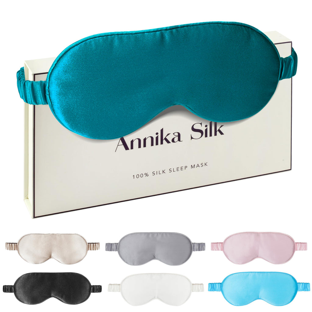 Peacock Blue sleep mask over an Annika Silk box, with six smaller mask color examples below.