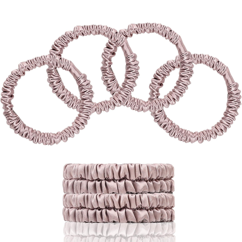 Four slim Lotus Pink scrunchies shown overlapping and stacked on a white background