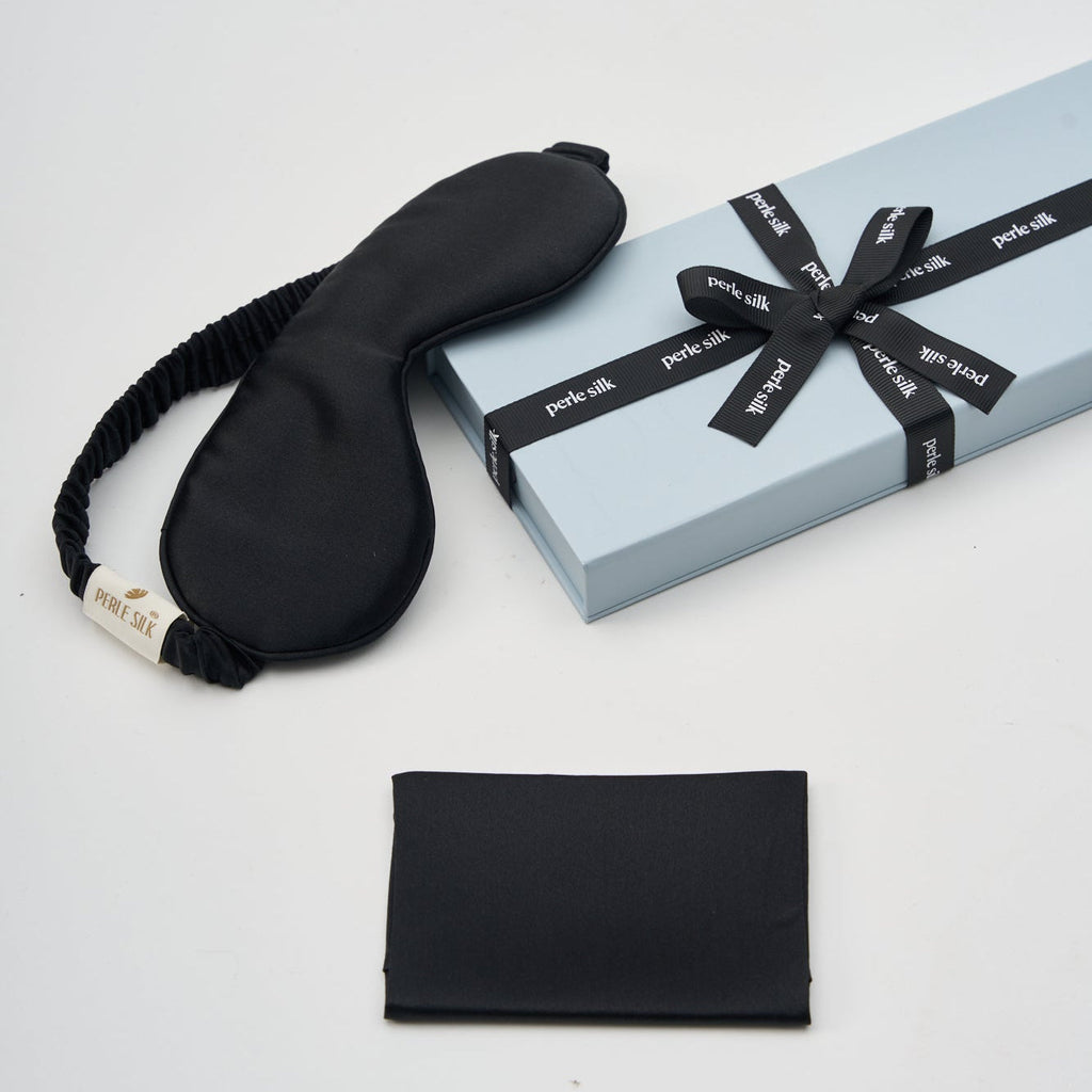 Black Charmeuse silk sleep mask by Perle Silk, soft and smooth sleep mask for restful nights and eye comfort.