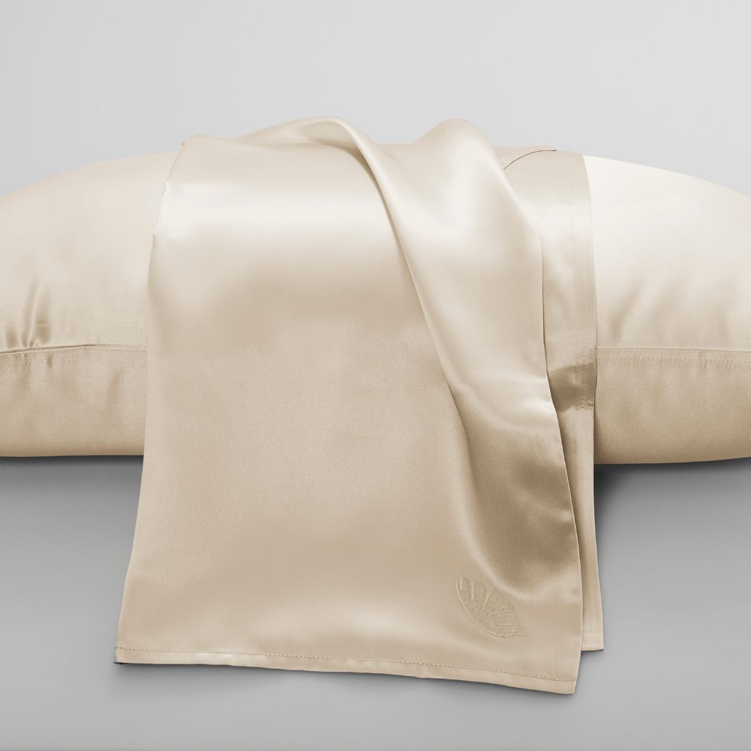 Soreia embroidered mulberry silk pillowcase in 22 Momme charmeuse with intricate embroidery, smooth and luxurious sleep accessory.