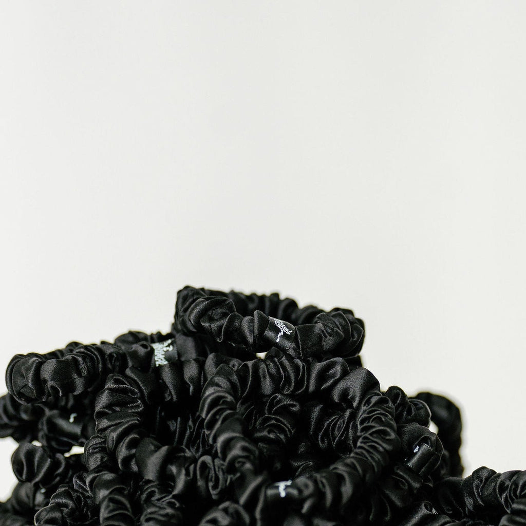 Organic silk black scrunchie by LINA LENNOX, small onyx black hair accessory with soft, glossy fabric and elastic band.