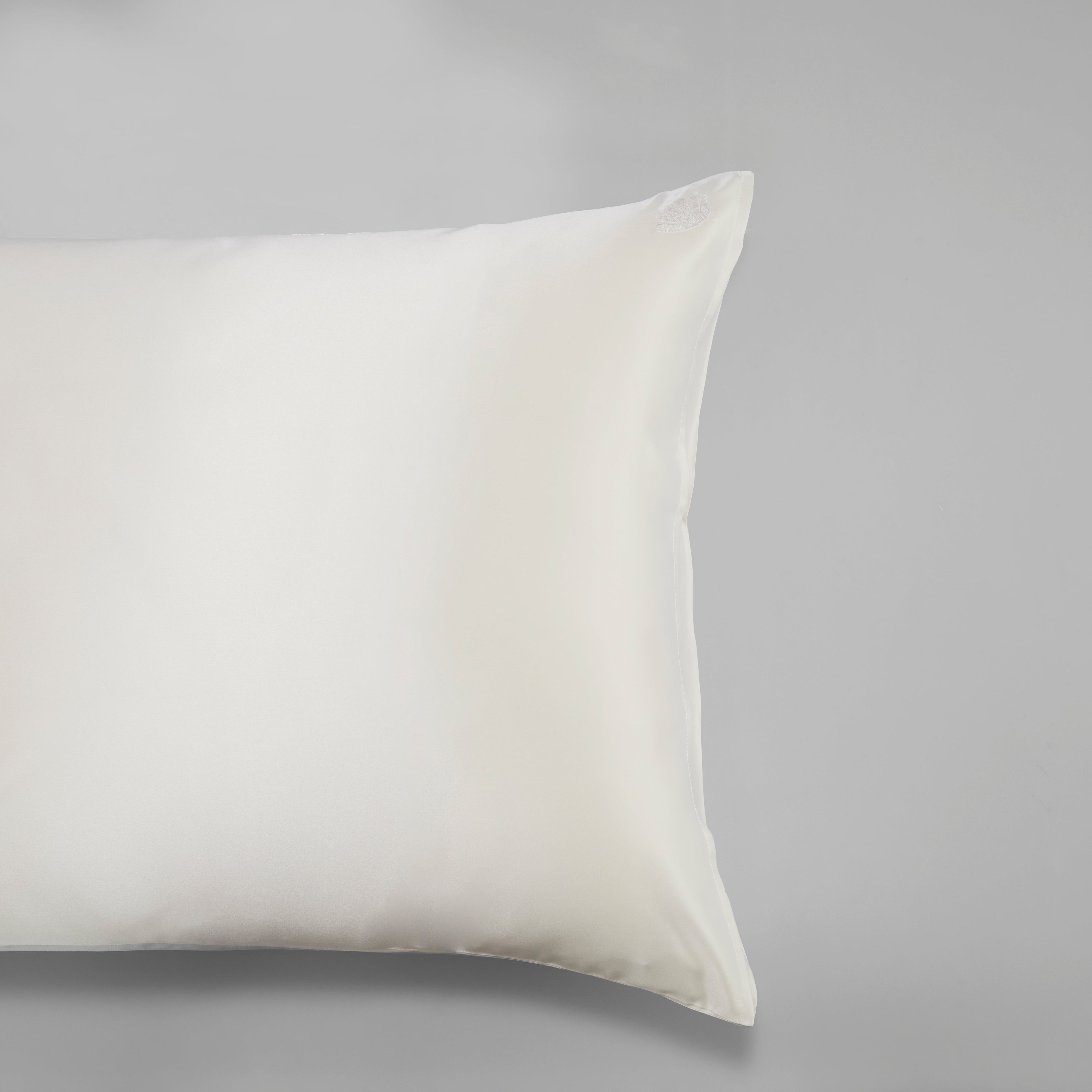 Elegant embroidered Mulberry silk pillowcase by Soreia, 22 Momme charmeuse with intricate embroidery and smooth, luxurious fabric.