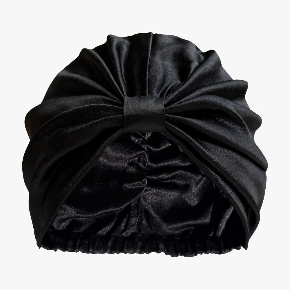 Soreia Silk Sleep Set with black organic silk bonnet and contoured silk sleep mask on a white background.
