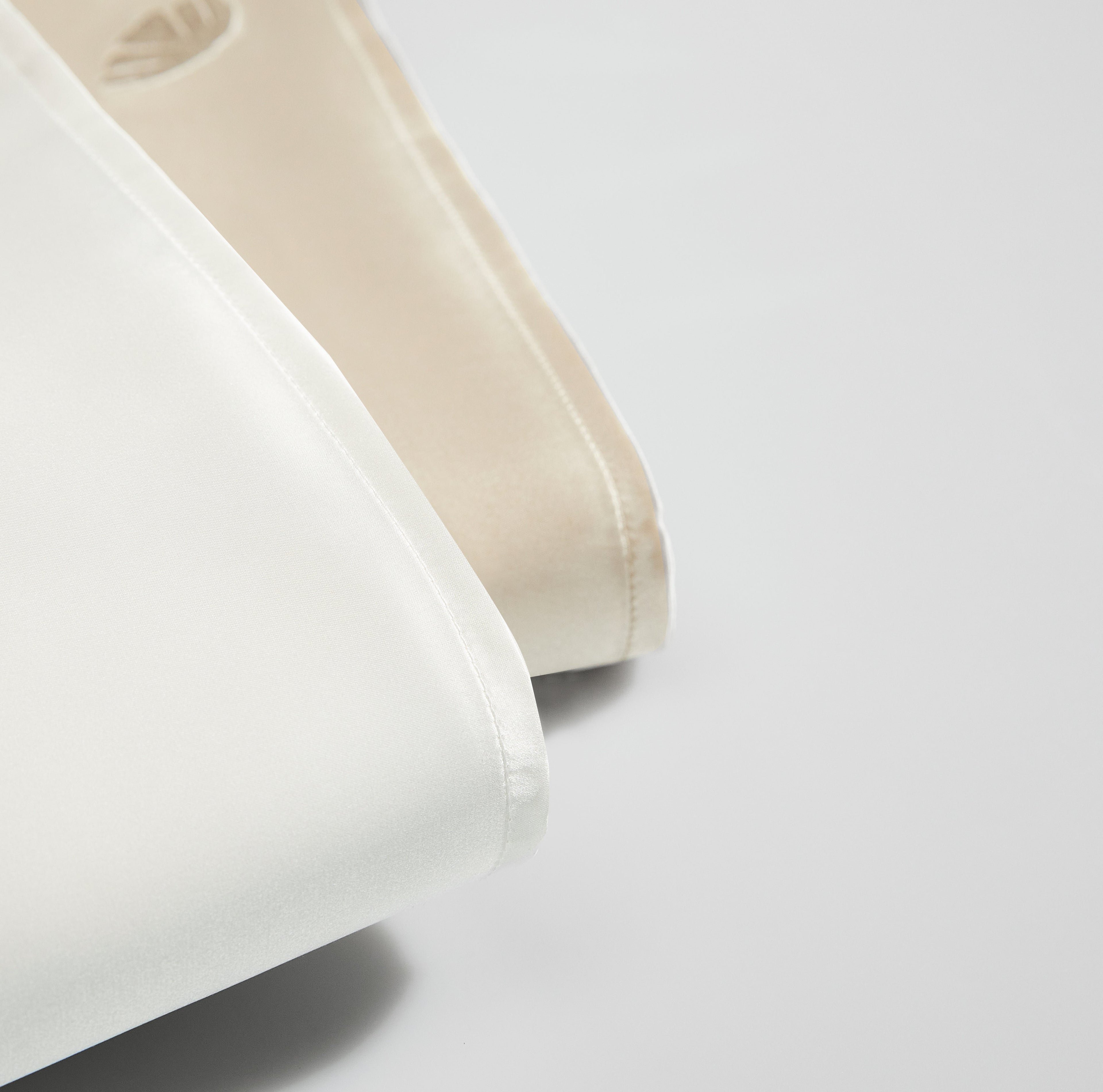 Soreia embroidered mulberry silk pillowcase in 22 Momme charmeuse, showing smooth, luxurious silk fabric with detailed embroidery.