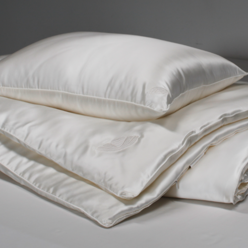 All season Mulberry silk comforter with Grade 6A silk fill from Soreia, showcasing its soft, luxurious fabric and cozy design.