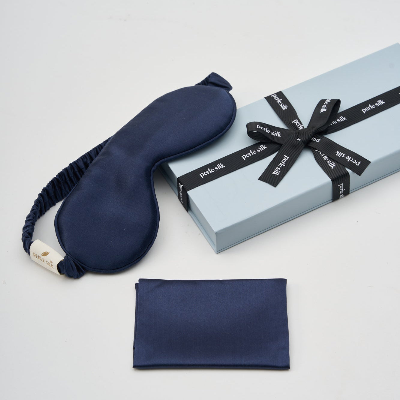 Navy charmeuse silk sleep mask by Perle Silk, soft and smooth silk eye mask for restful sleep.