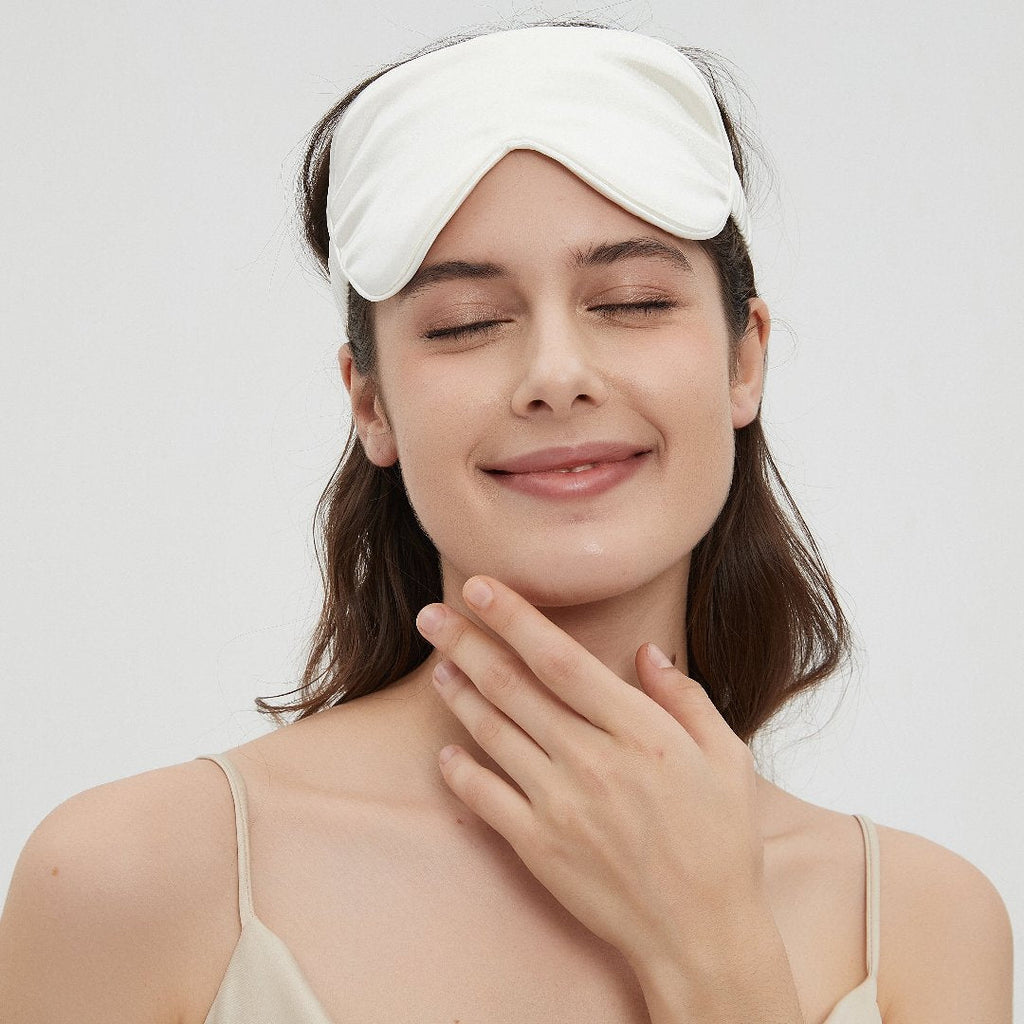 White charmeuse silk sleep mask by Perle Silk, soft and luxurious eye mask for restful sleep and gentle eye comfort.