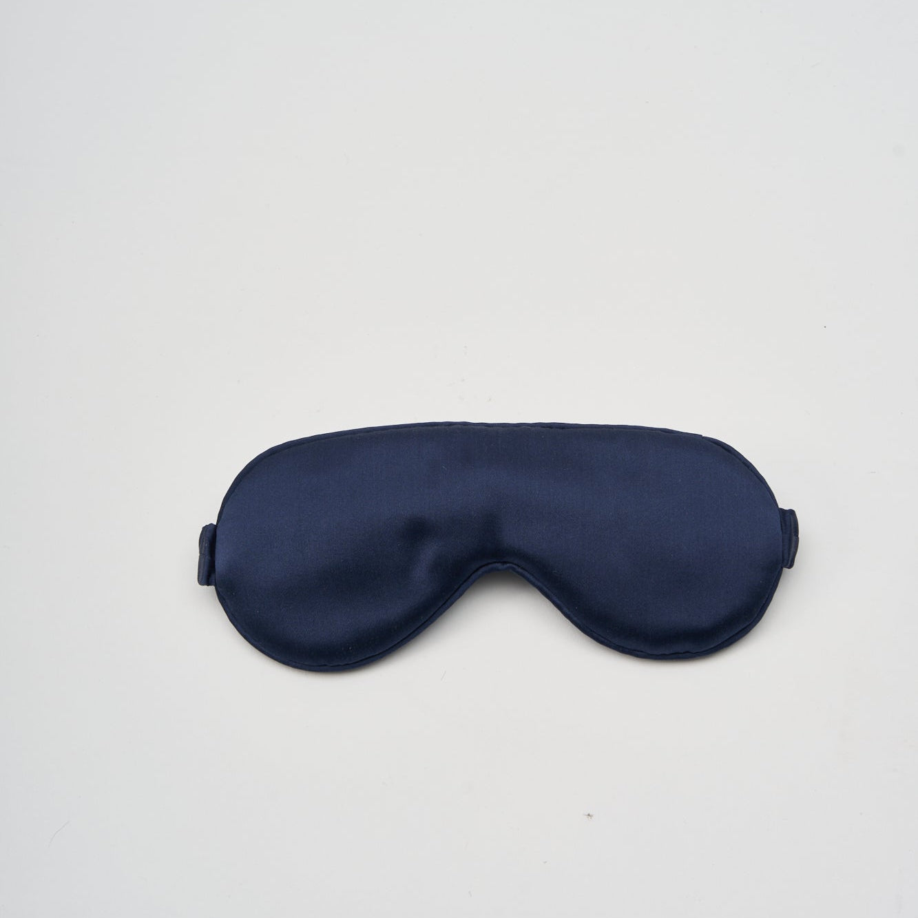 Perle Silk charmeuse silk sleep mask with soft, smooth fabric and adjustable strap for comfortable rest.