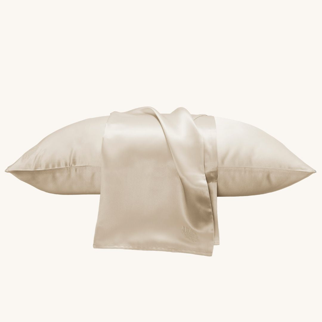 Luxurious champagne silk pillowcase by Soreia, 22 Momme charmeuse embroidered mulberry silk for smooth, elegant sleep.