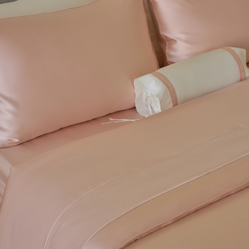 Close-up of Soreia Charmeuse Silk Flat Sheet in Rosewood color, showcasing smooth, lustrous pure mulberry silk fabric.