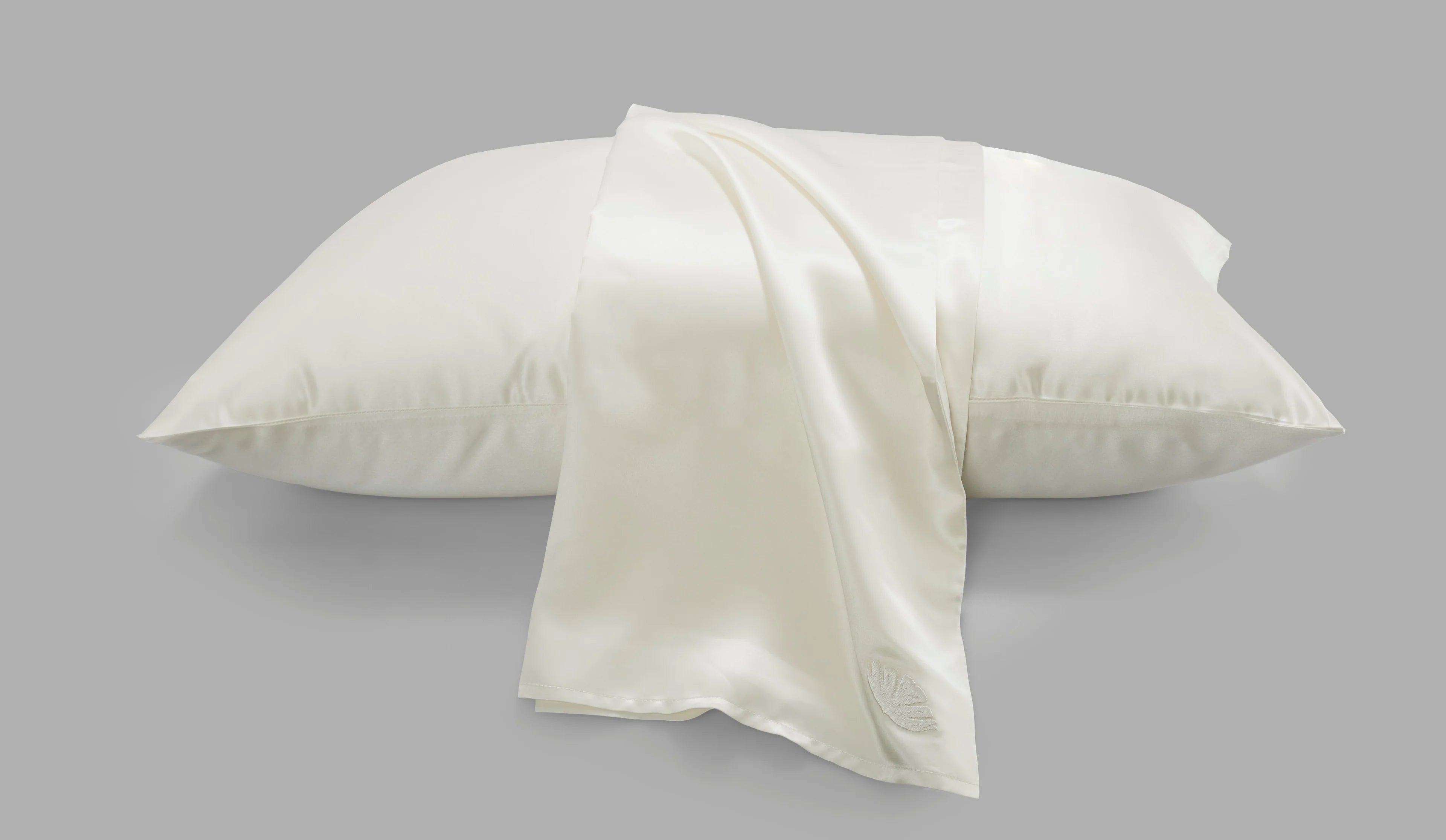 White Soreia Beauty Sleep Silk Pillowcase made of 22 Momme Mulberry silk with delicate embroidery, standard size.