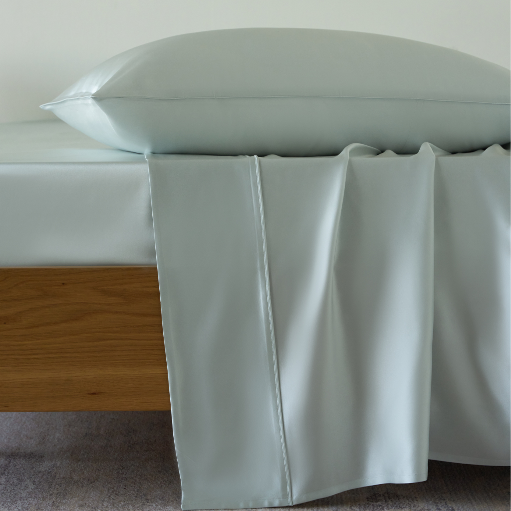 Soreia Charmeuse silk flat sheet in sky blue, made from pure mulberry silk, 22 momme, machine washable, smooth and luxurious.