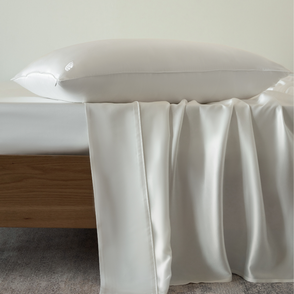 White Soreia Charmeuse silk flat sheet made of 22 Momme Mulberry silk, machine washable, with a smooth, luxurious texture.