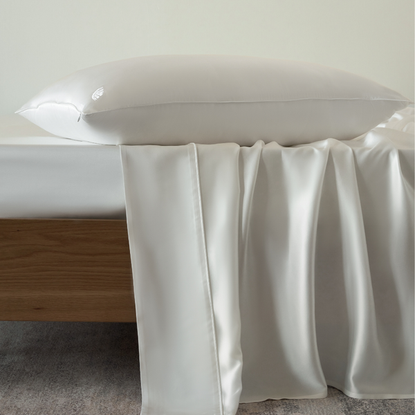 White Soreia Charmeuse silk flat sheet made of 22 Momme Mulberry silk, machine washable, with a smooth, luxurious texture.