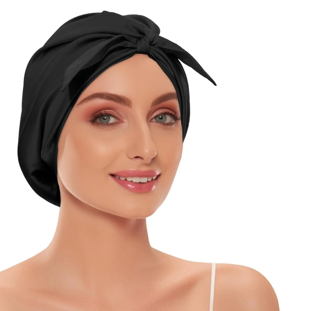 Soreia Silk Sleep Set featuring a champagne-white silk pillowcase, sleep mask, bonnet, and scrunchies for luxurious bedtime comfort.